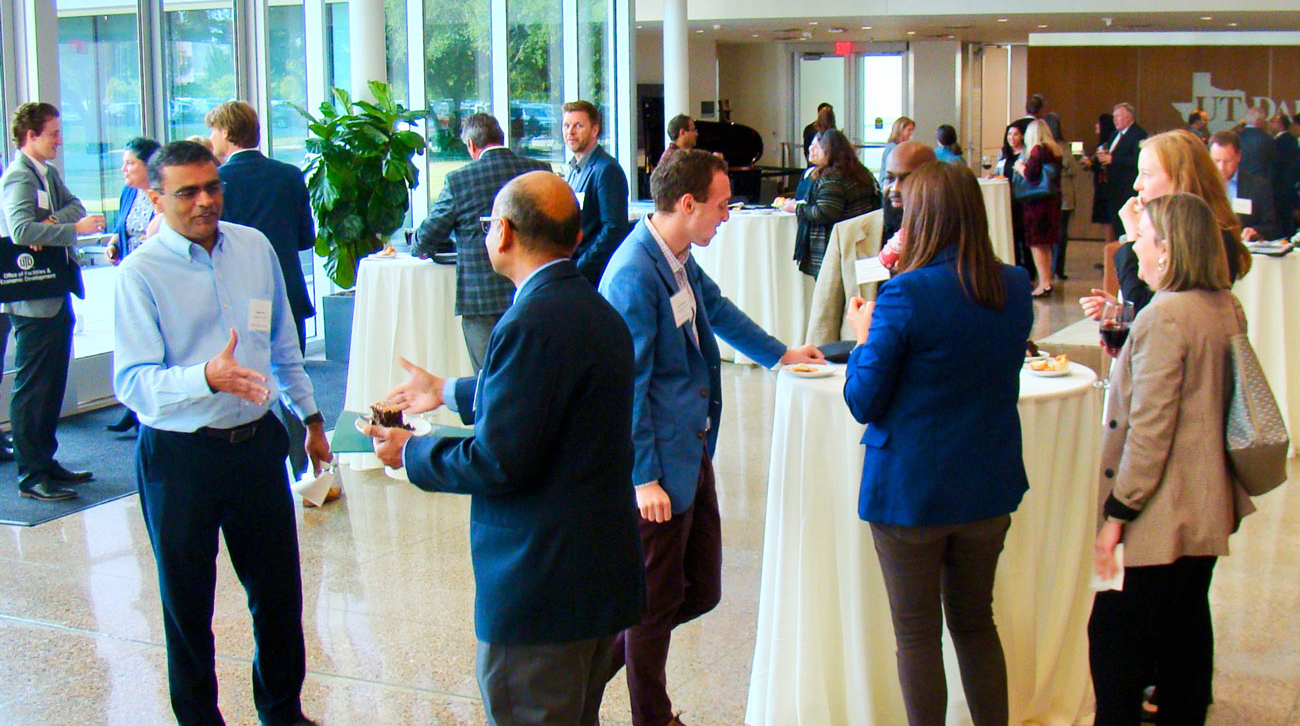 Mixer attendees engaging in conversation