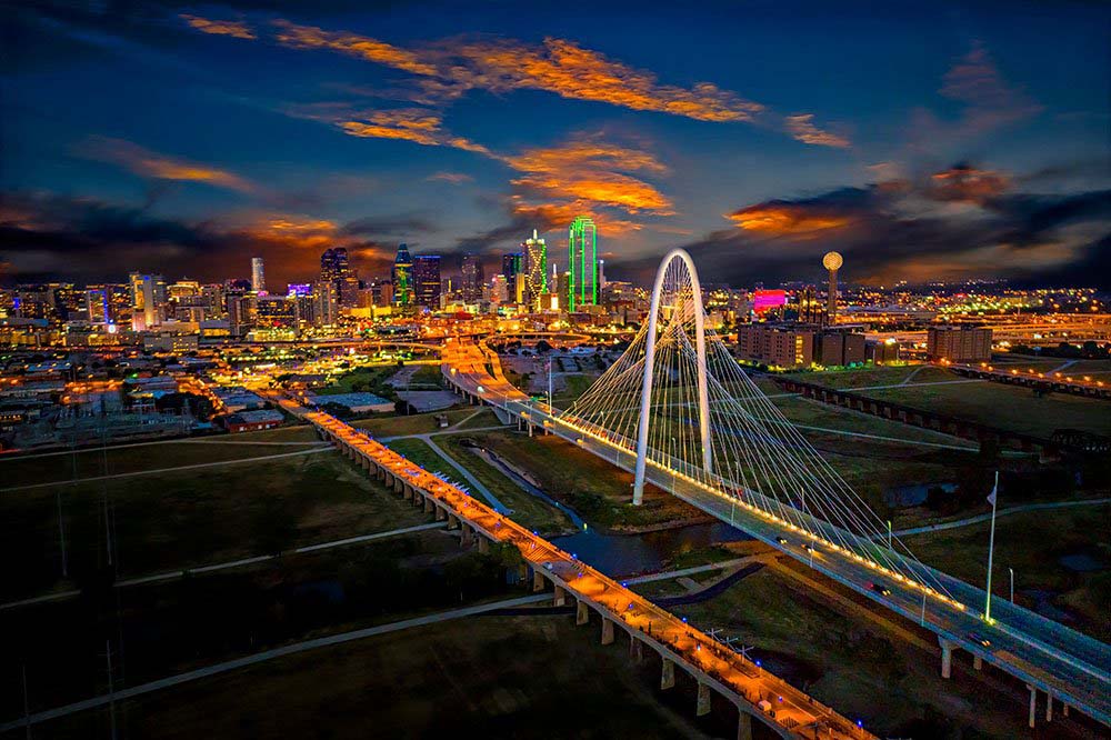 Margaret Hunt Hill Bridge spanning the Trinity River leading toward downtown Dallas.