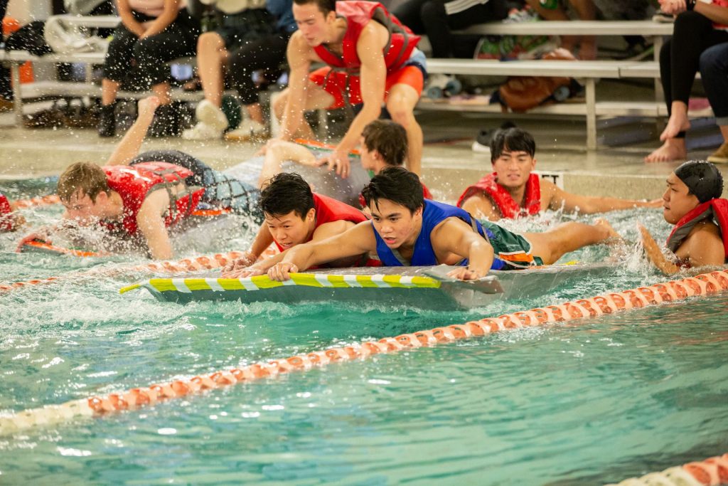 Photo of students competing in the Cardboard Boat Regatta