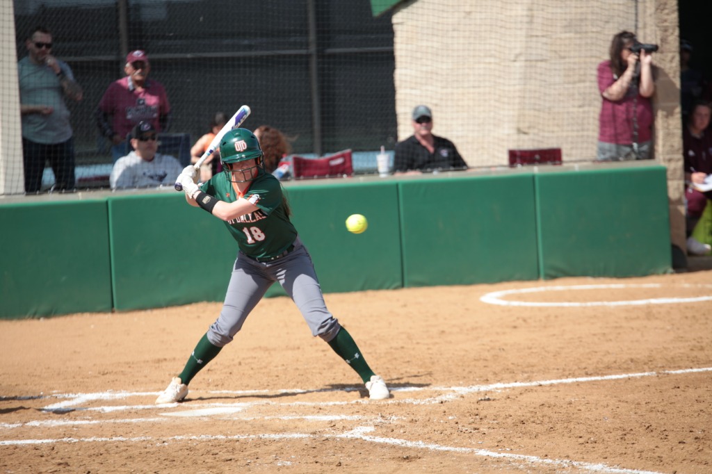 Photo of a softball player at bat.