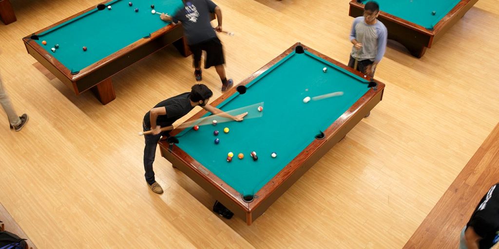 students playing billiards at the Student Union