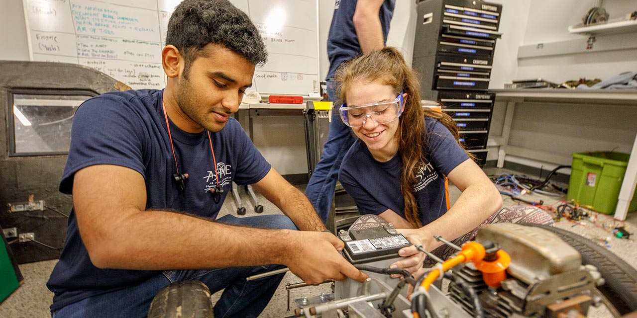 Engineering students work on a project