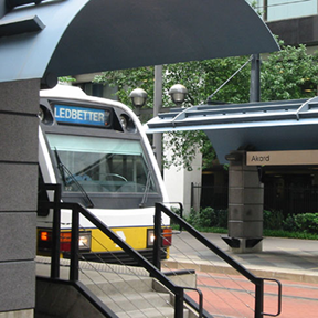 A blue line train at a DART Station