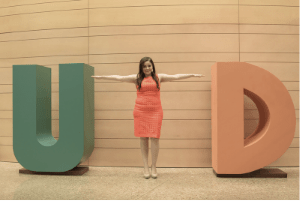 A student forms the T in a UTD display